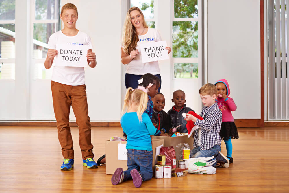 image of volunteers and children