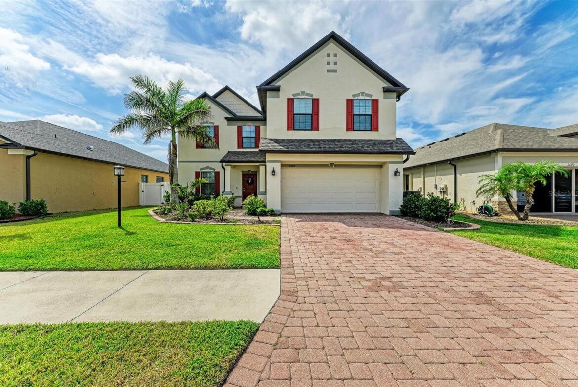 Exterior front view of 5-bedroom, 3-bath rental home in gated Villa Milano, Port Charlotte, FL