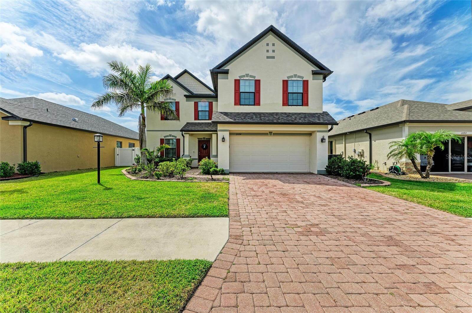 Exterior front view of 5-bedroom, 3-bath rental home in gated Villa Milano, Port Charlotte, FL