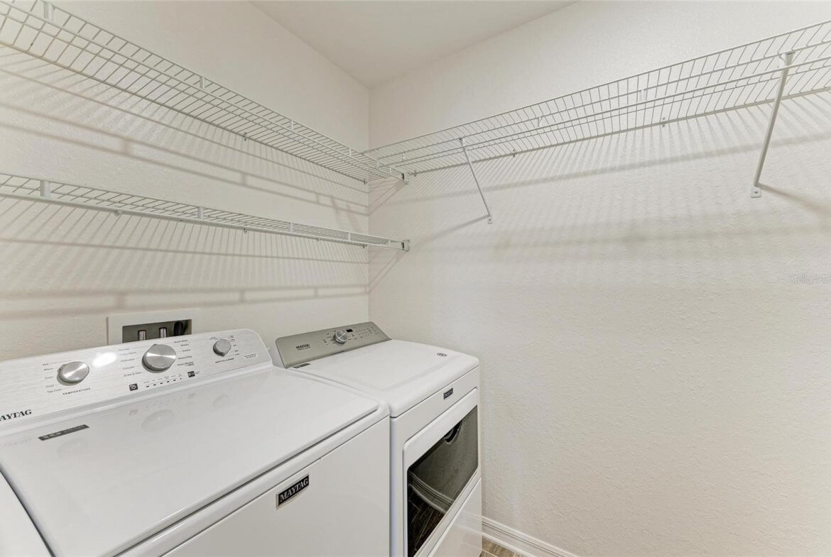 Convenient second-floor laundry room with washer and dryer in Villa Milano rental home