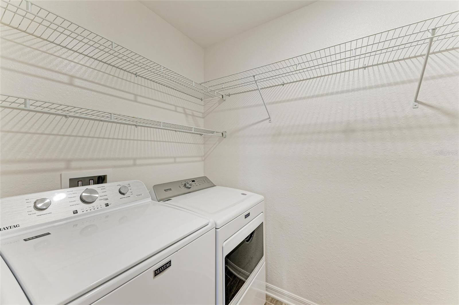 Convenient second-floor laundry room with washer and dryer in Villa Milano rental home