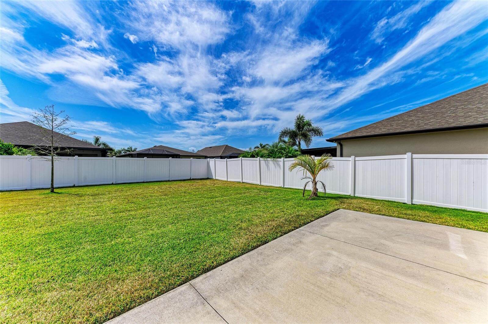 Backyard and patio space in Villa Milano rental home, Port Charlotte