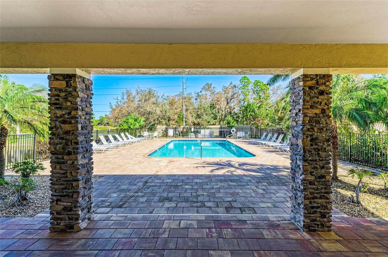Villa Milano gated community pool and lounge area in Port Charlotte, Florida