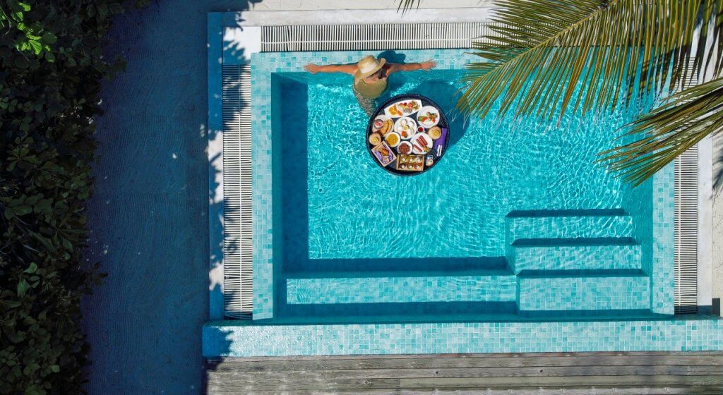 image of woman in luxury pool