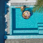 image of woman in luxury pool
