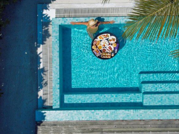 image of woman in luxury pool